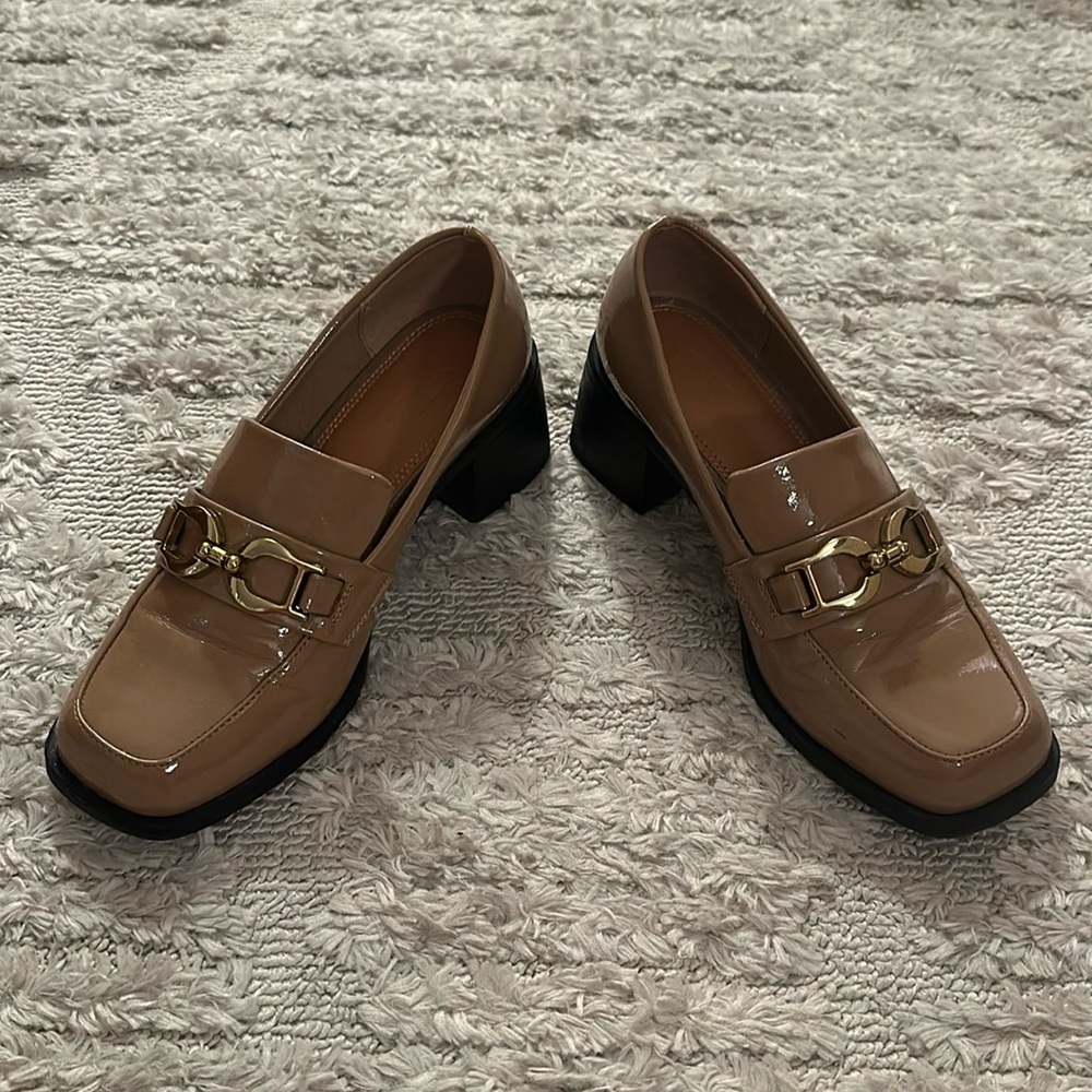 Tan patent leather loafers with block heal and gold buckle